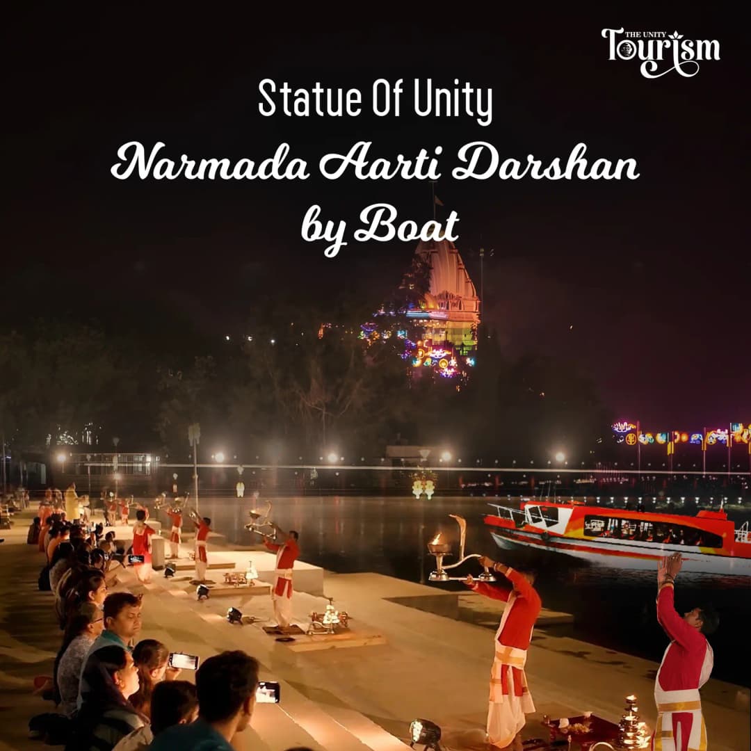 Tourist boat sailing in front of the Statue of Unity on the Narmada River.