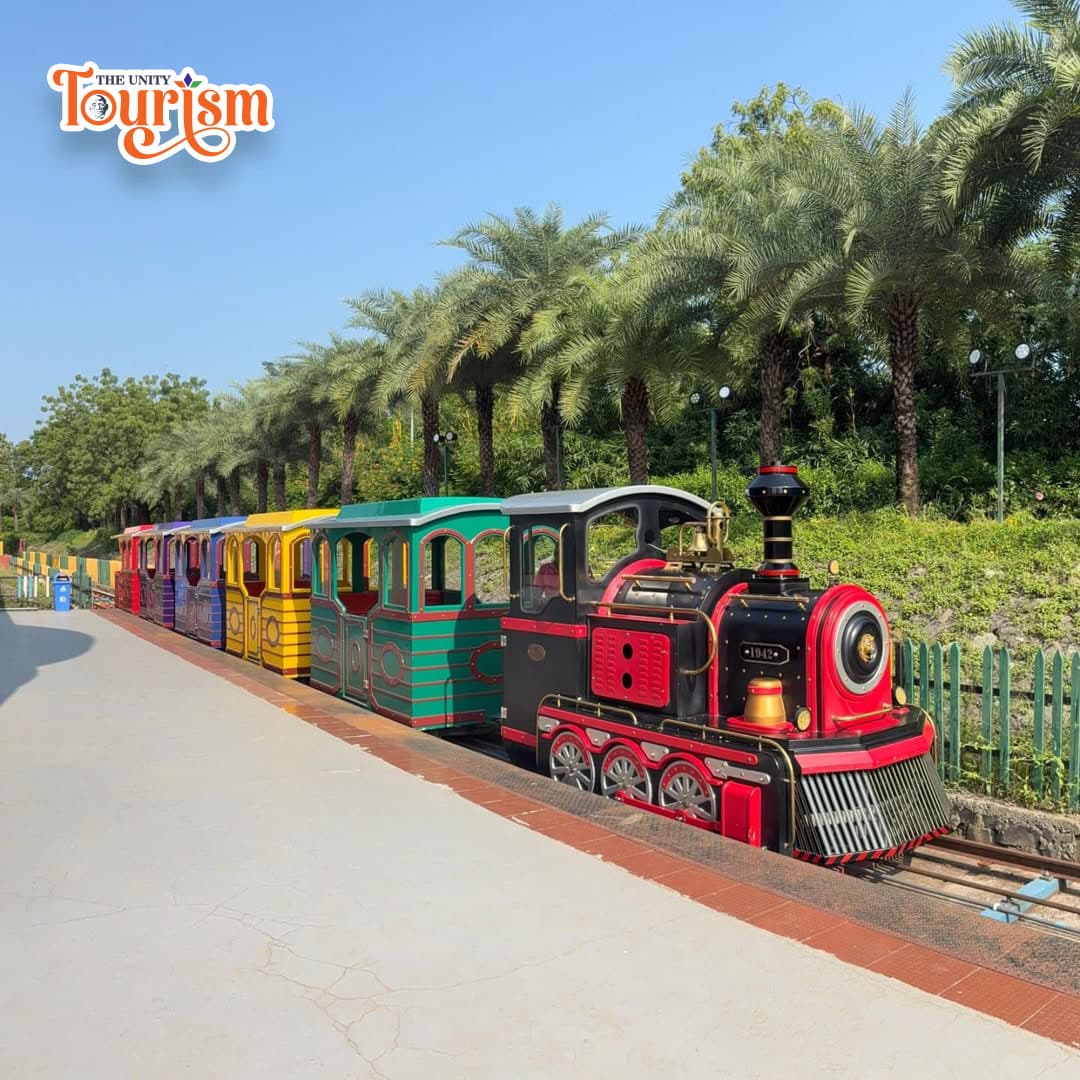 Colorful toy train ride at Statue of Unity for children and families in scenic surroundings
