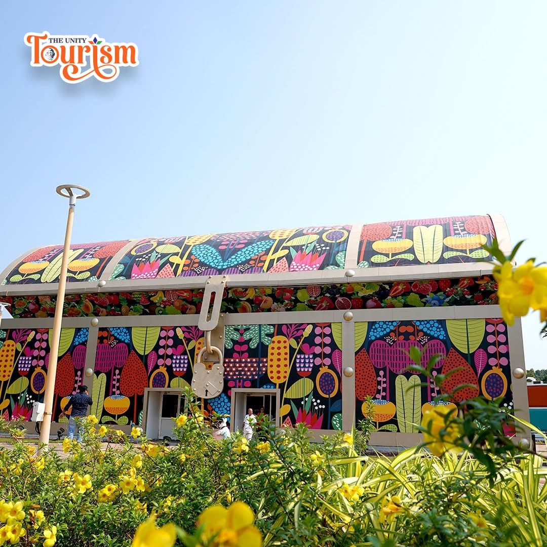 Colorful floral themed building at Unity Tourism, vibrant attraction for visitors