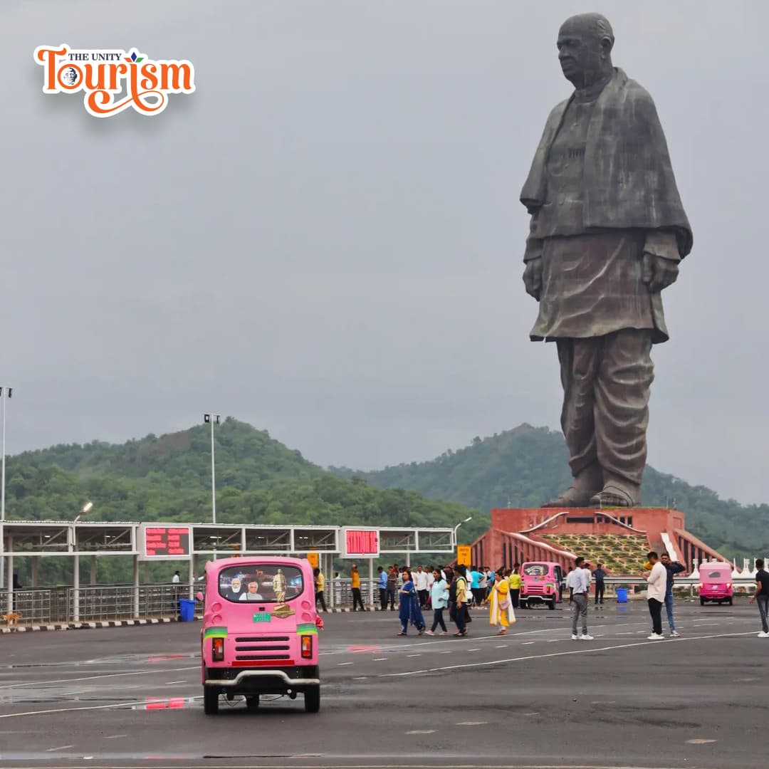 Statue Of unity Base View With Pink Electric rickshaw In parking Area