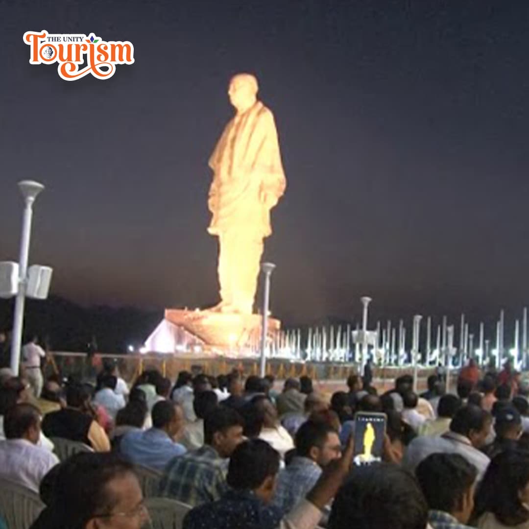Vibrant 3D projection mapping visuals on the Statue of Unity riverfront.