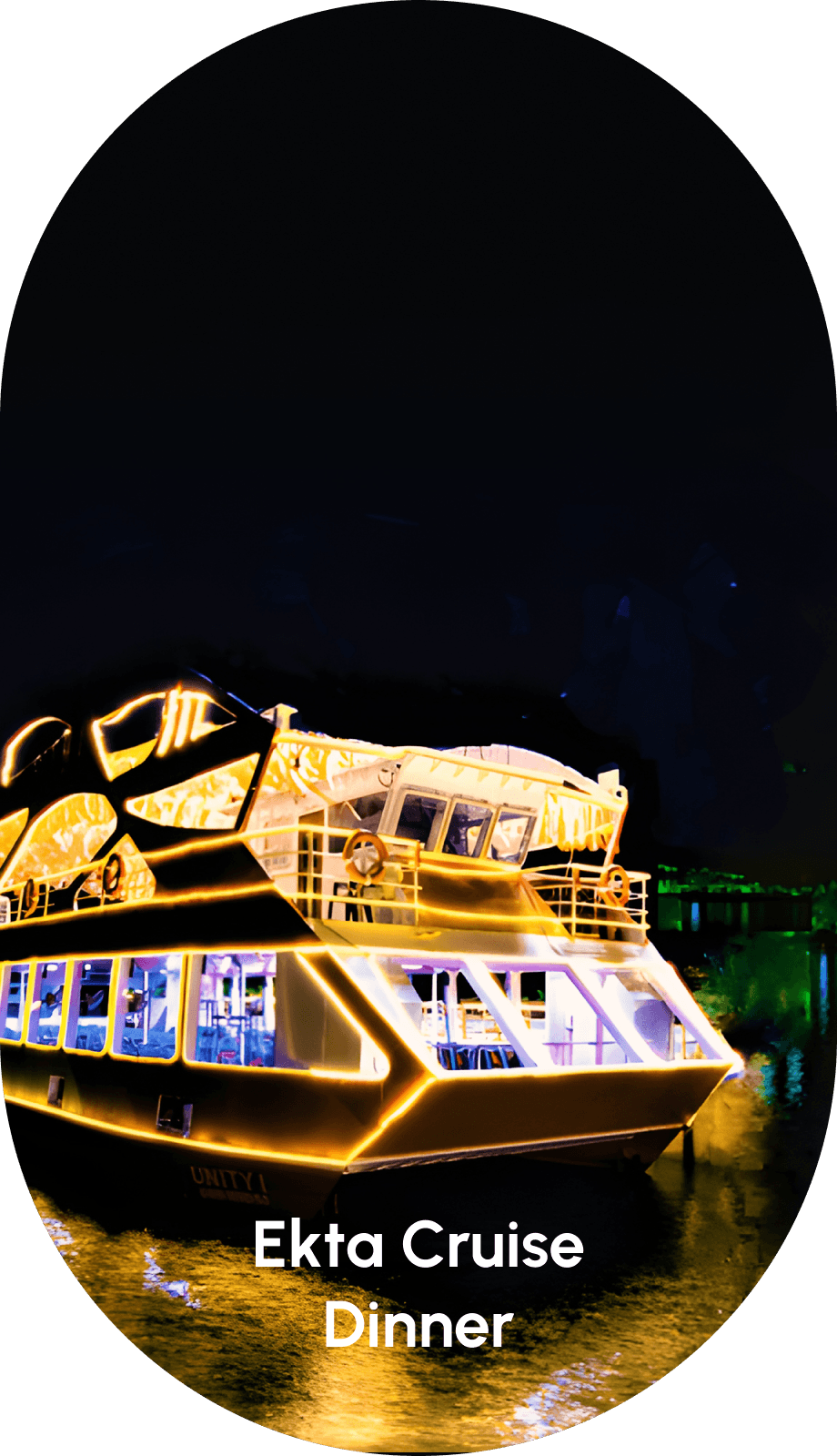 Statue of Unity Ekta Cruise Dinner boat glowing at night near the giant statue on Narmada River.