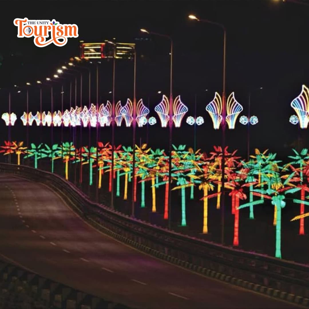    A busy highway featuring bright, colorful lights along the edges, enhancing the scene with a festive glow.