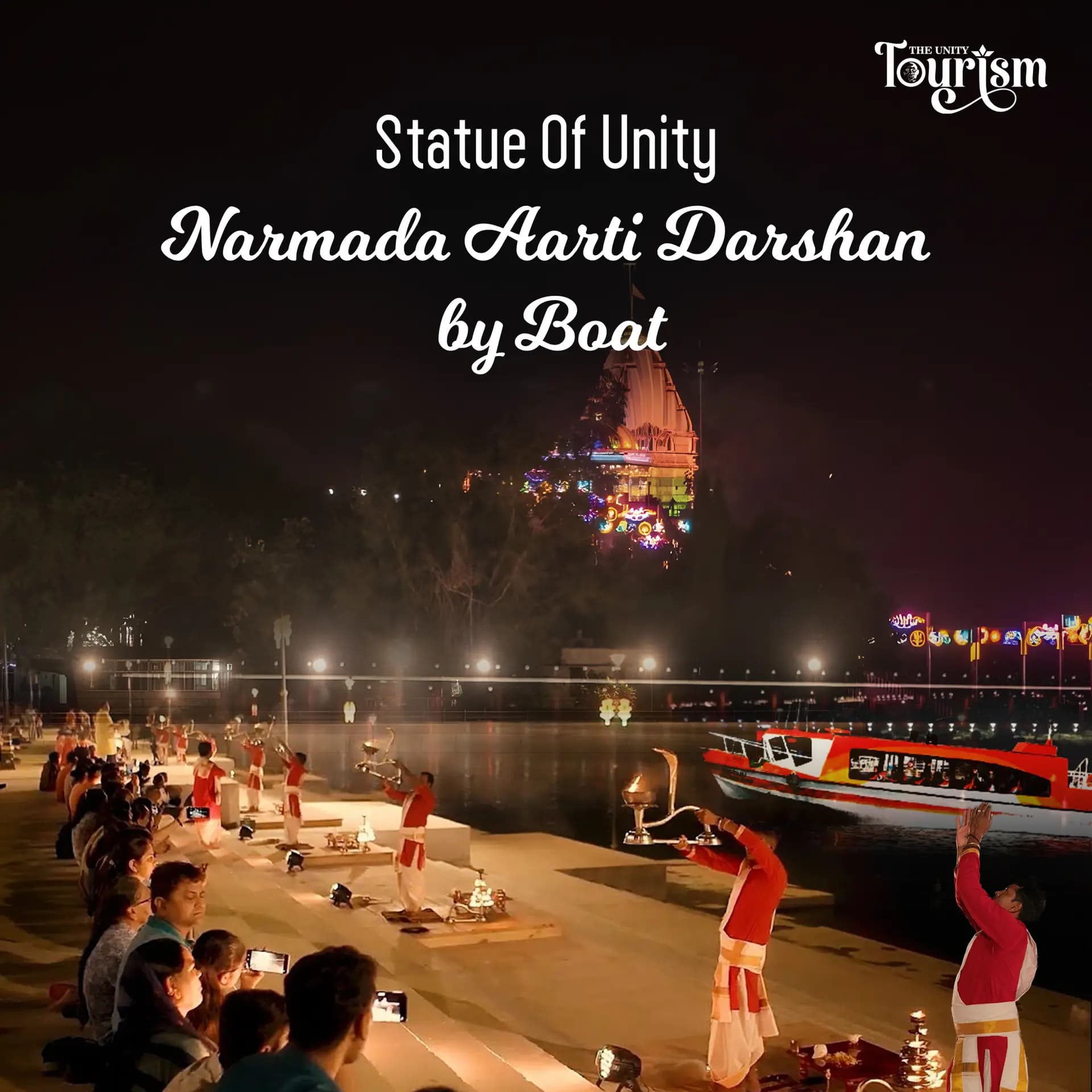 Tourist boat sailing in front of the Statue of Unity on the Narmada River.