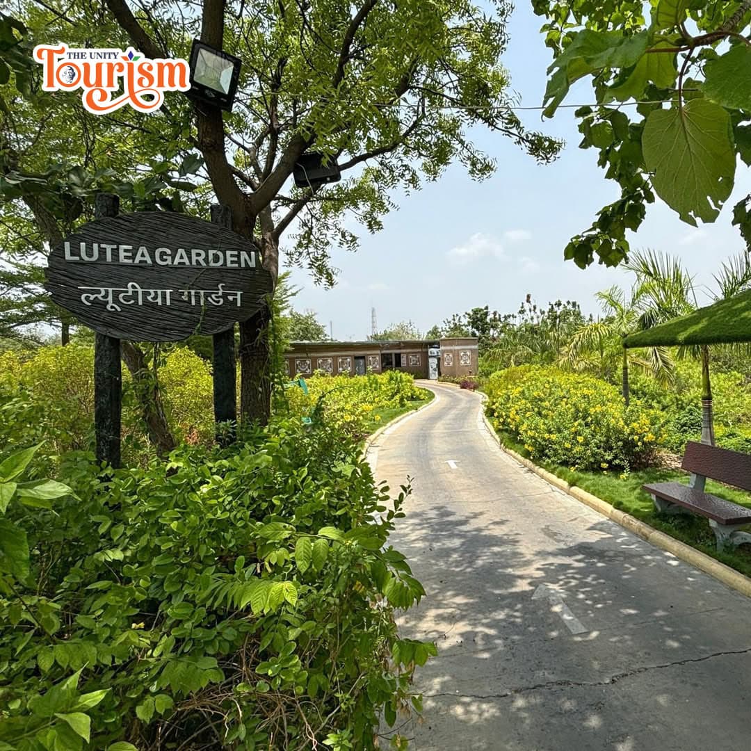 Scenic view of Lutea Garden at the Statue of Unity, showcasing colorful blooms and well-maintained pathways.