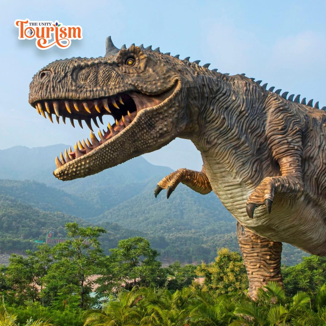 A T-Rex dinosaur statue, towering and detailed, captures the essence of the prehistoric creature in an outdoor environment.