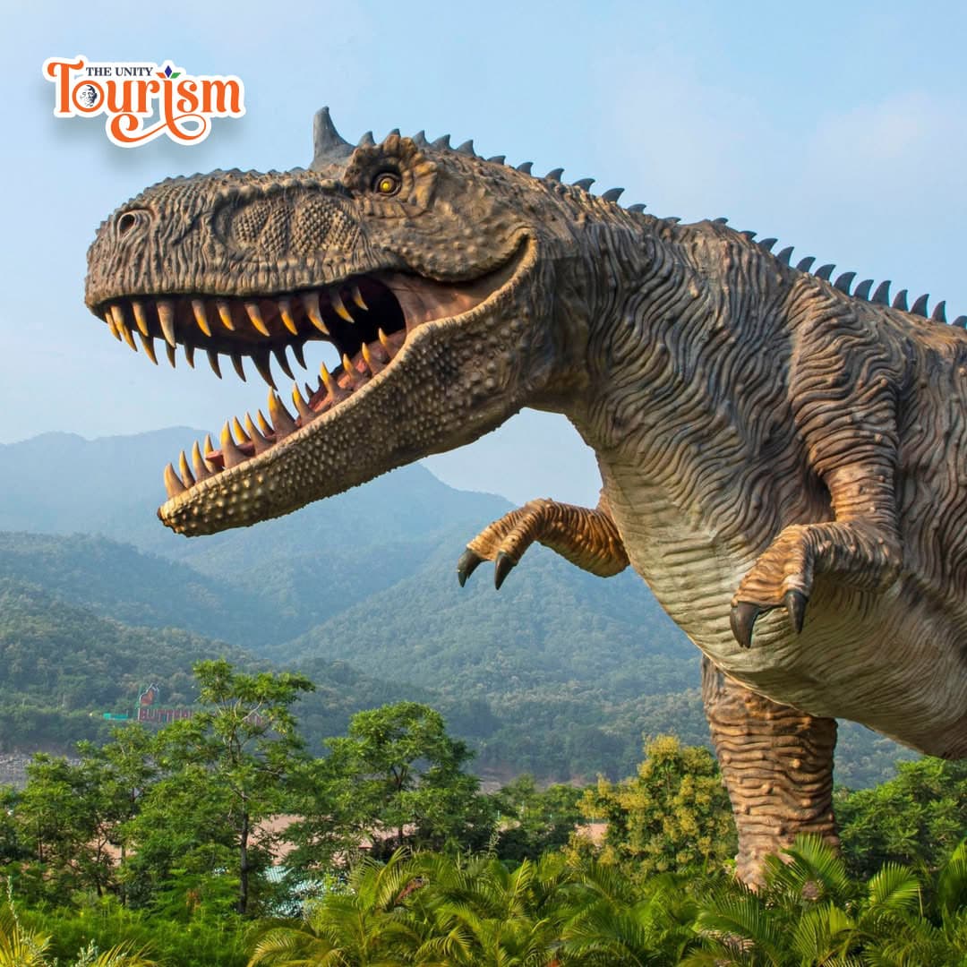 A T-Rex dinosaur statue, towering and detailed, captures the essence of the prehistoric creature in an outdoor environment.