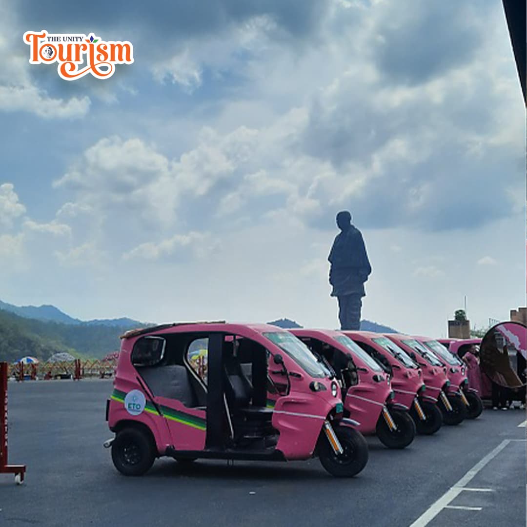  Pink e-rickshaws parked with majestic Statue of Unity in the backdrop