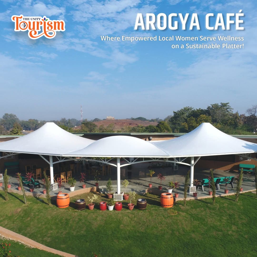 Beautiful garden seating area at Unity Tourism with grass-covered umbrellas