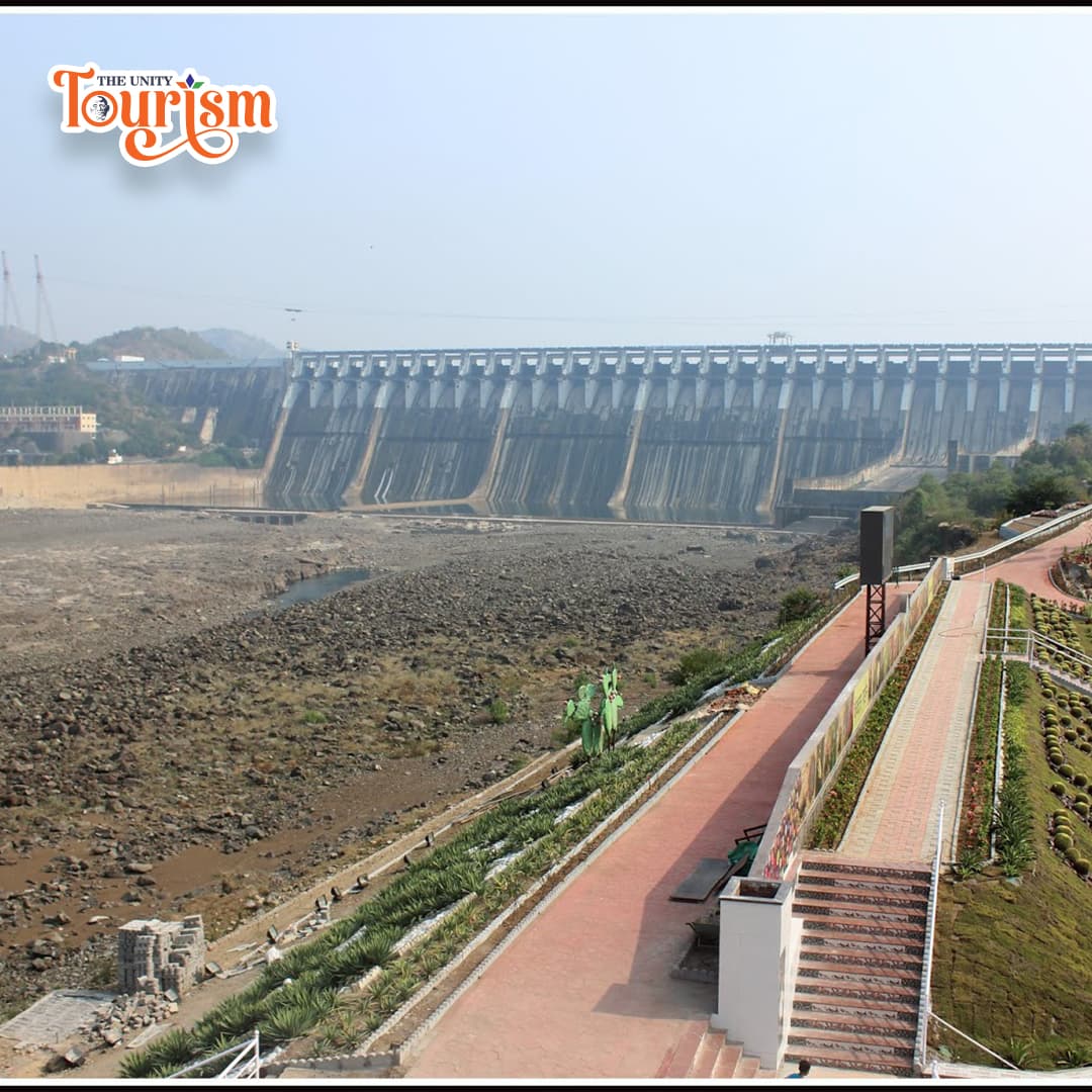 Visitors taking photographs at Sardar Sarovar Dam viewpoint near Kevadia
