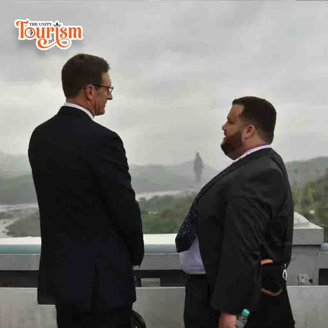 International visitors viewing Statue of Unity from a scenic viewpoint – The Unity Tourism