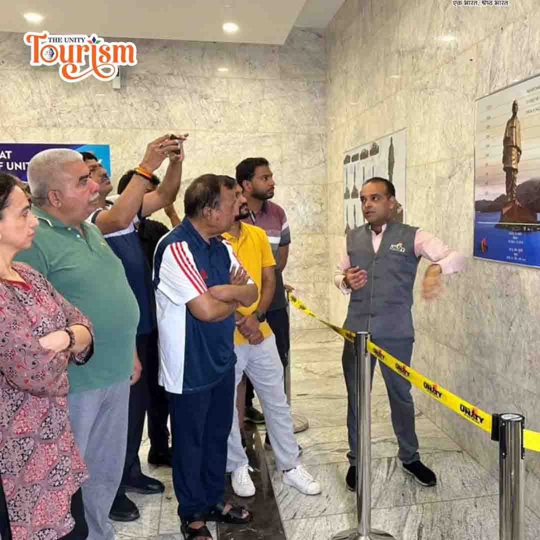 Tour guide at Statue of Unity explaining history and significance to visitors