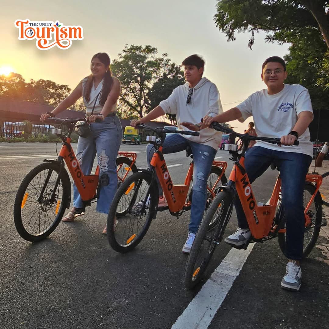 Tourist couple cycling experience at Statue of Unity Riverfront track