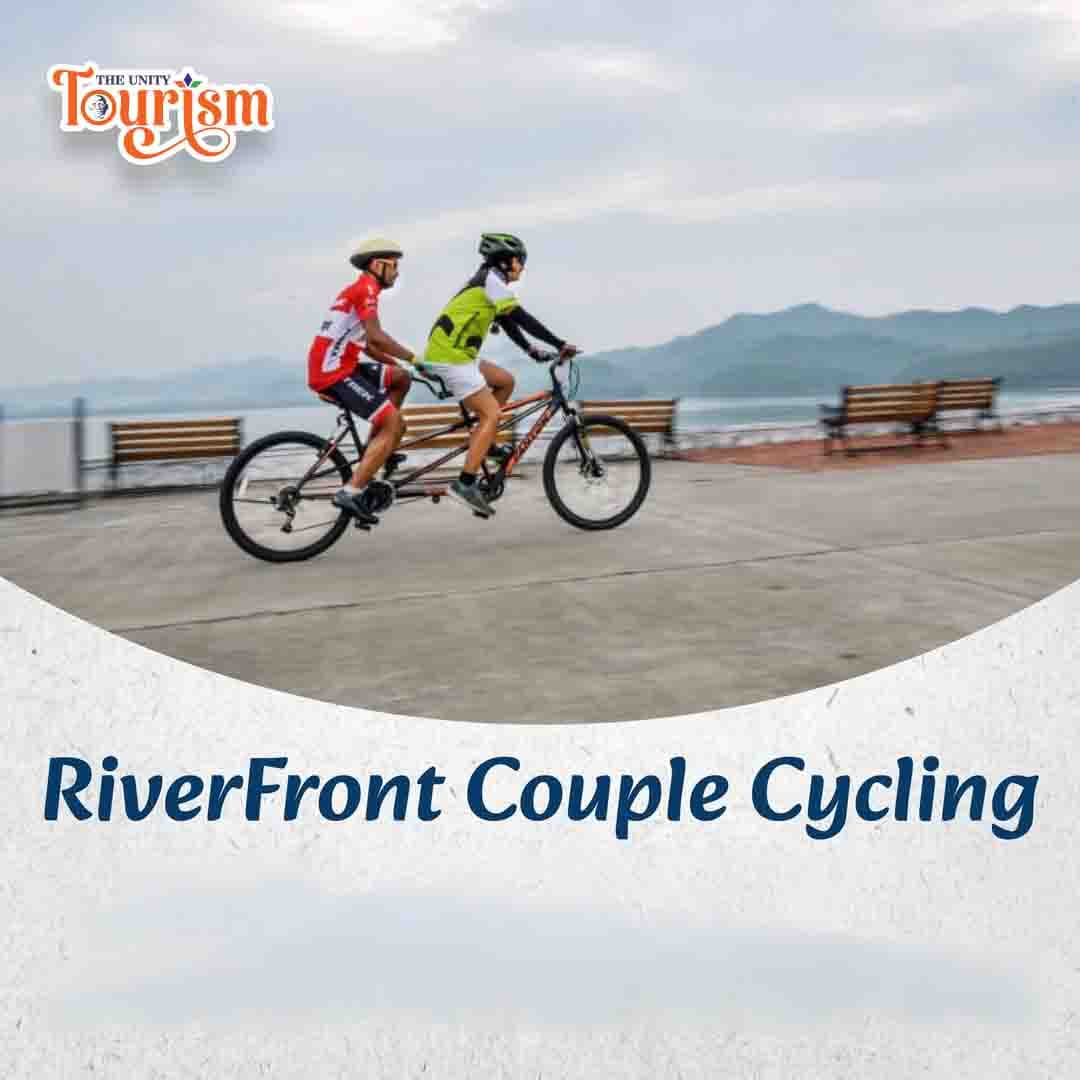 Couple cycling together on the scenic riverfront track near Statue of Unity.