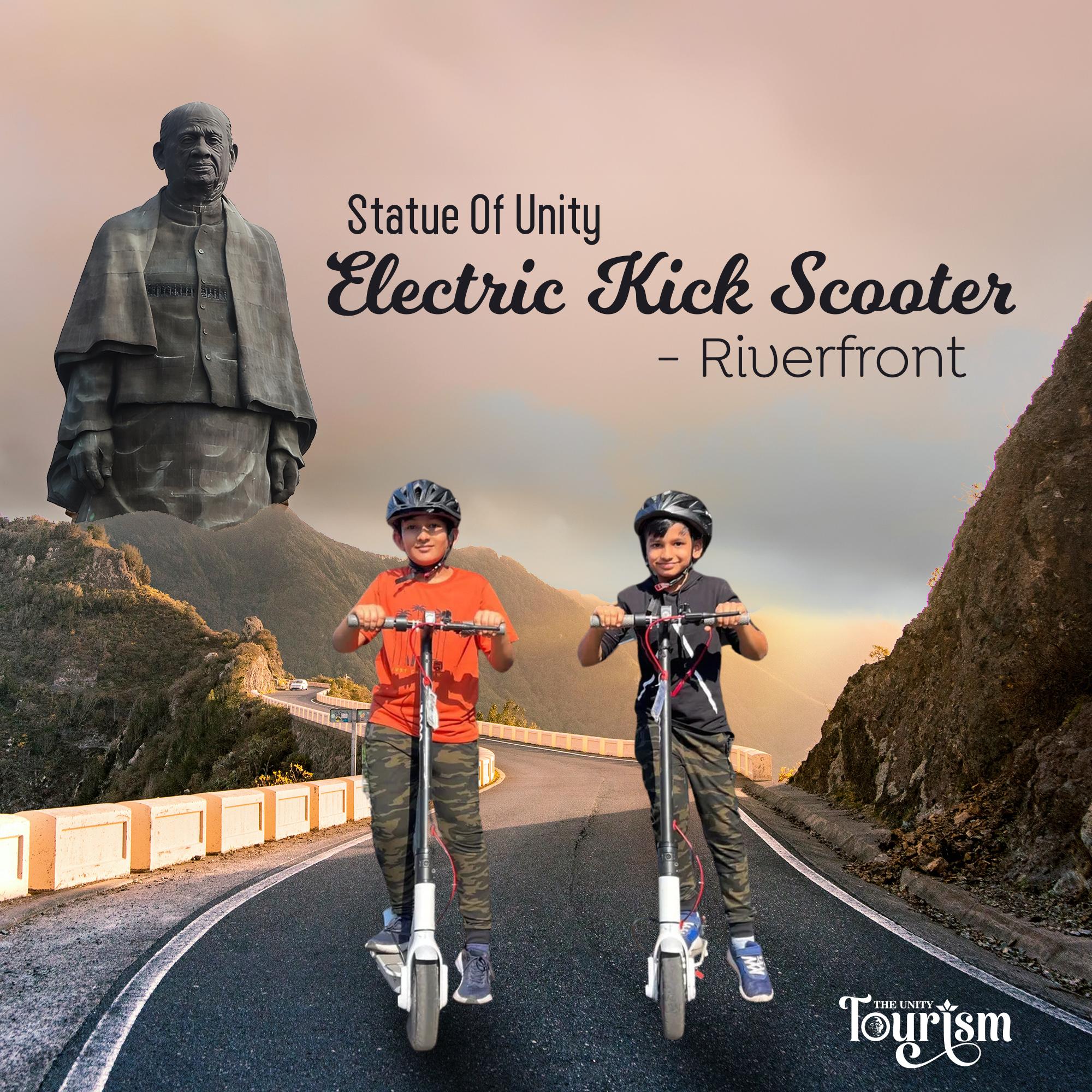 Two kids riding electric kick scooters at Statue of Unity riverfront with scenic mountain backdrop